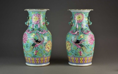 A pair of Chinese famille rose turquoise ground vases, Qing Dynasty