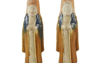 A pair of Chinese painted and sancai-glazed attendants
