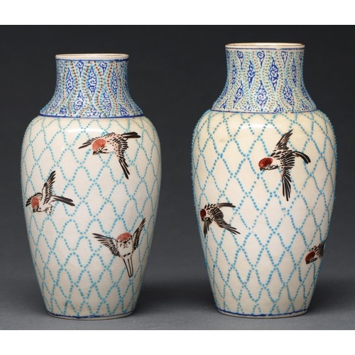 A pair of Japanese satsuma vases, decorated in the manner of...