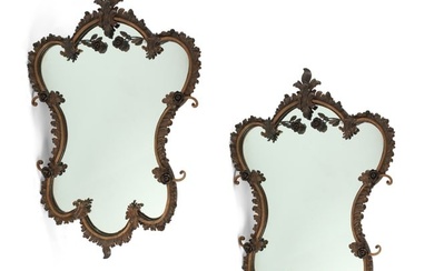 A pair of Rococo style metal mirrors