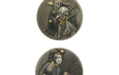 A pair of Shakudo earrings.
