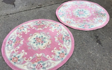 A pair of circular Chinese wool aubusson style rugs with...
