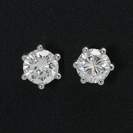 SOLD. A pair of diamond solitaire ear studs each set with a brilliant-cut diamond weighing a total of app. 0.75 ct., mounted in 18k rhodium plated gold. W/VS-SI. (2) – Bruun Rasmussen Auctioneers of Fine Art
