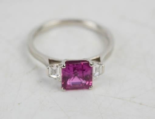 A platinum, pink sapphire and diamond ring, the square cut p...