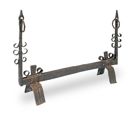 A rare double-ended wrought iron fire dog