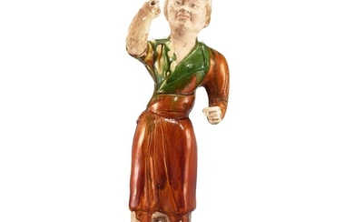 A sancai figure of a groom, Tang dynasty 唐 三彩馬伕立俑