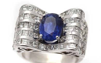 NOT SOLD. A sapphire and diamond ring set with a sapphire weighing app. 5.00 ct. encirceld by diamonds, mounted in 18k white gold. Size app. 57. – Bruun Rasmussen Auctioneers of Fine Art
