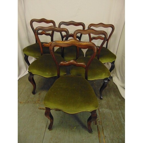 A set of six Victorian rosewood balloon back upholstered din...