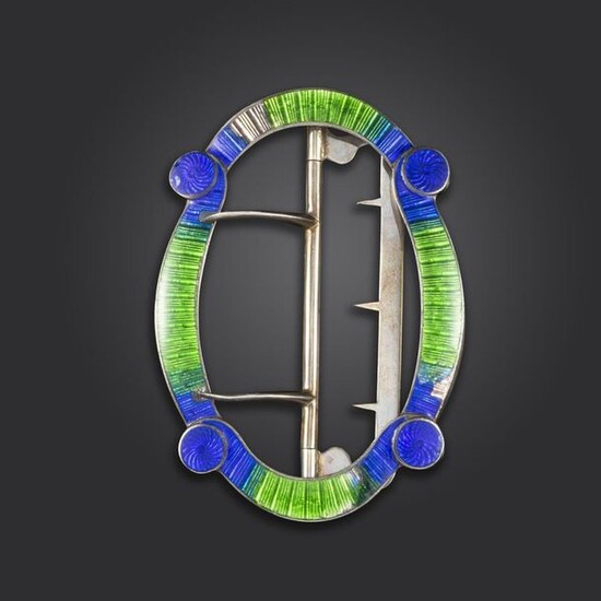 A silver and enamel belt buckle by Child & Child, formed with interlocking scrolls with blue and green enamel decoration (damaged), signed to reverse with maker~s mark and WC HC for Walter & Harold Child, London hallmarks for 1898, 7.5cm wide