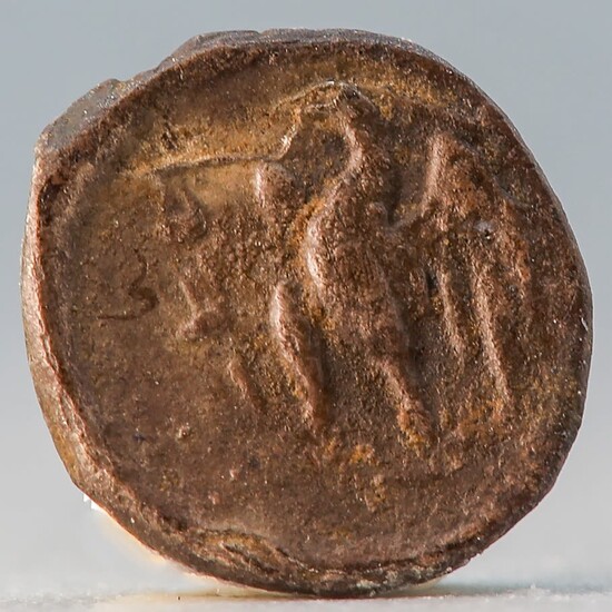 A silver coin from Yehuda under Ptolemaic rule. Obv.:...