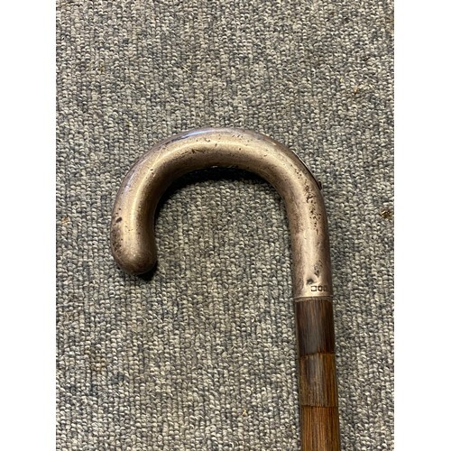 A silver mounted bookmaker's gadget stick, the handle with p...