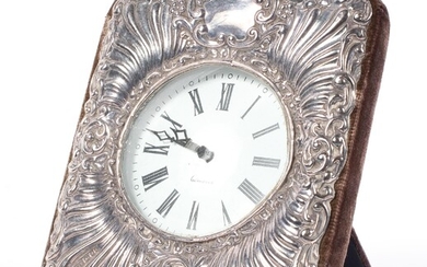 A silver mounted quartz clock, cast with rocailles and cartouches, hallmarked London, 1991