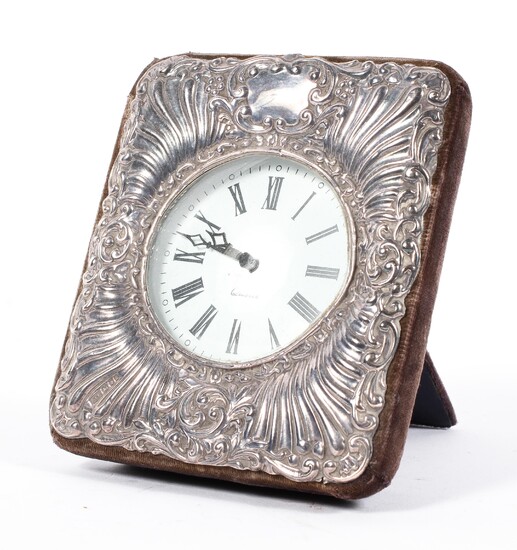 A silver mounted quartz clock, cast with rocailles and cartouches, hallmarked London, 1991