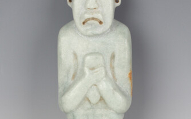A substantial pre-Columbian Olmec style carved pale green hardstone standing male figure, probably 9