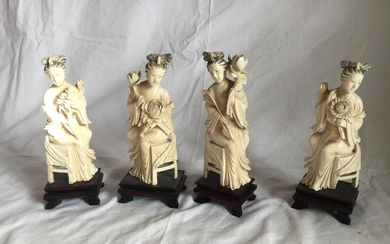 A suite of four women in ivory sitting...
