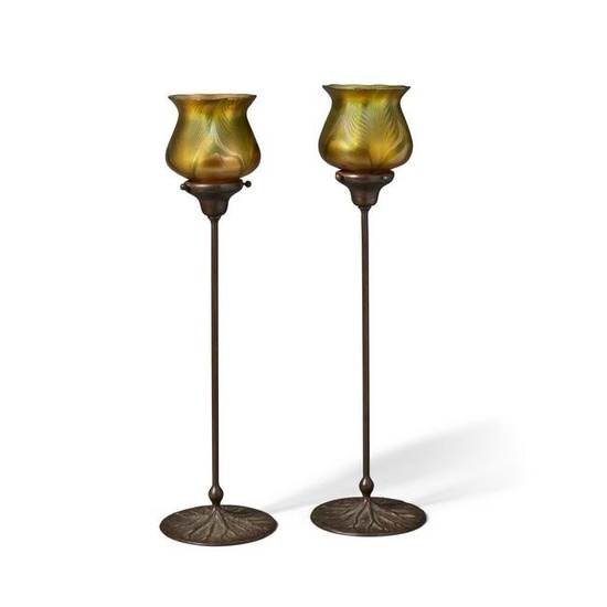 AMERICAN ARTS & CRAFTS Pair of Candlestickscirca 1910patinated bronze bases with Quezal decorate...