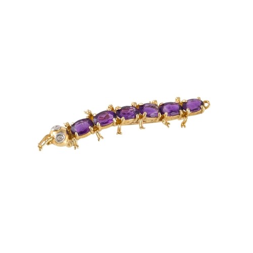 AN AMETHYST SET NOVELTY BROOCH, mounted in 14ct gold, modell...