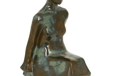 AN ART DECO GLAZED TERRACOTTA FIGURE OF A SEATED WOMAN