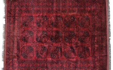 Afghan Ersari Carpet, circa 1970 The claret field with rows...