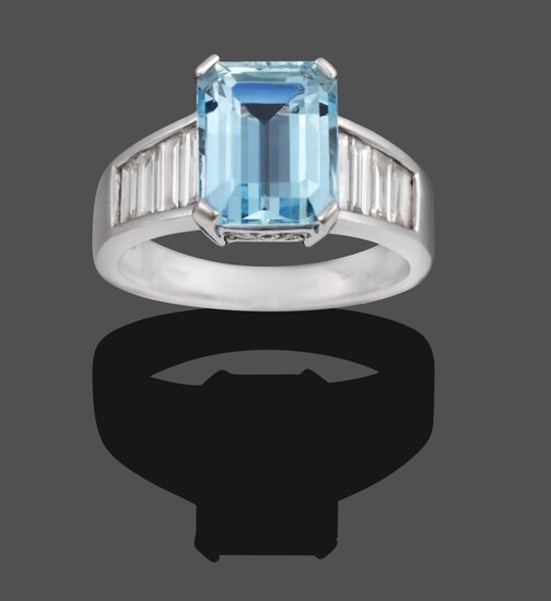 An 18 Carat White Gold Aquamarine and Diamond Ring, the emerald-cut aquamarine in a white four claw