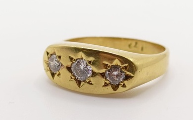 An 18ct gold three stone diamond gypsy set ring, ring size P