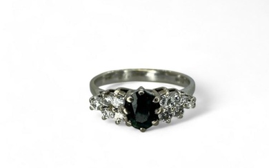 An 18ct white gold diamond & sapphire dress ring. Size...