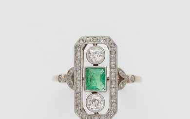 An Art Déco 14k gold platinum diamond and emerald ring.