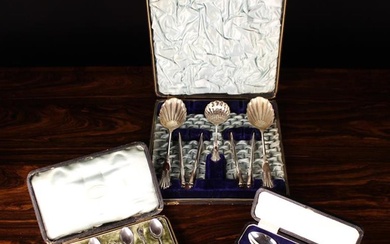 An Attractive Edwardian Cased Set of Silver Plated Serving Spoons, a sifting spoon and a pair of nut