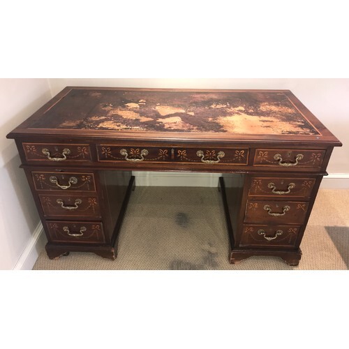 An Edwardian mahogany inlaid kneehole desk with garland and ...