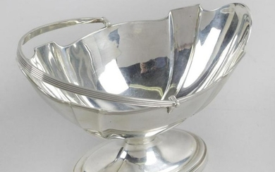 An Edwardian silver swing-handled sugar basket, of