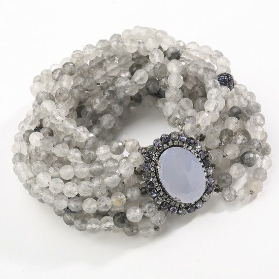 An agate and sapphire bracelet with numerous gray agate pearls and clasp set with oval-cut chalcedony encircled by faceted iolites, mounted in oxidized silver.