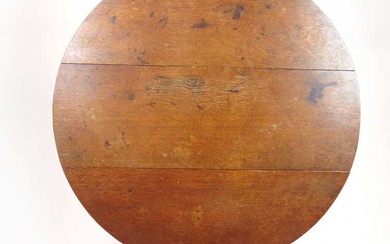 An early 19th century oak tilt top tripod table, the...