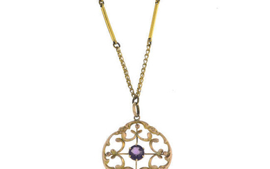 An early 20th century 9ct gold purple composite gem pendant, with chain.