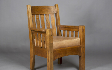 An early 20th century American Mission Arts and Crafts oak framed armchair, probably made by Harden