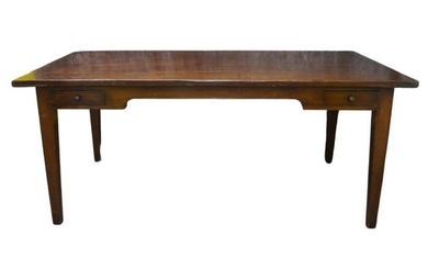 An early 20th century French farmhouse mahogany dining table, the plank top above two drawers, raised on square tapered legs, 76cm high, 183cm wide, 97cm deep Provenance: Property of Future PLC, removed from the offices of Country Life magazine.