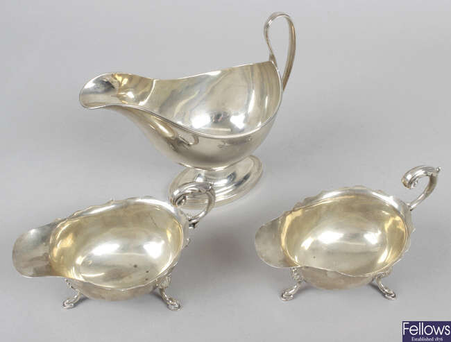 An early George V silver pedestal sauce boat, together with a pair of 1930's Scottish silver sauce boats.