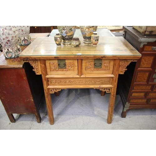 Antique Chinese carved elm two drawer table, well carved fro...