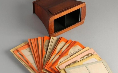 Antique mahogany stereo viewer with various paper