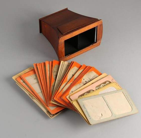 Antique mahogany stereo viewer with various paper