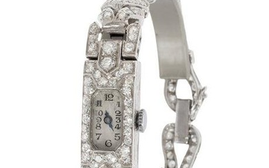 Art deco jewellery watch in platinum and diamonds. White dial, Arabic numerals, winding movement.