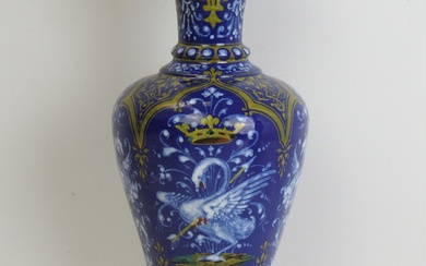 BLOIS - Josaphat TORTAT (1843-1915) : Vase sur piédouche en faience fond bleu à décor...