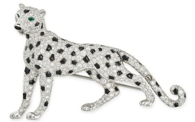 CARTIER, A DIAMOND, ONYX, AND EMERALD PANTHER BROOCH in platinum, designed as a standing panther