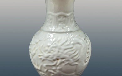 Chinese White Glazed Porcelain Vase Decorated With A Dragon