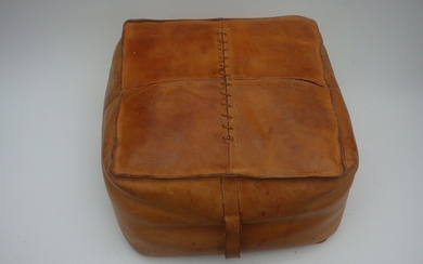 Designer unknown: A pouf upholstered with natural coloured leather, 20th century. H. 30 cm. W. 45. D. 45 cm.