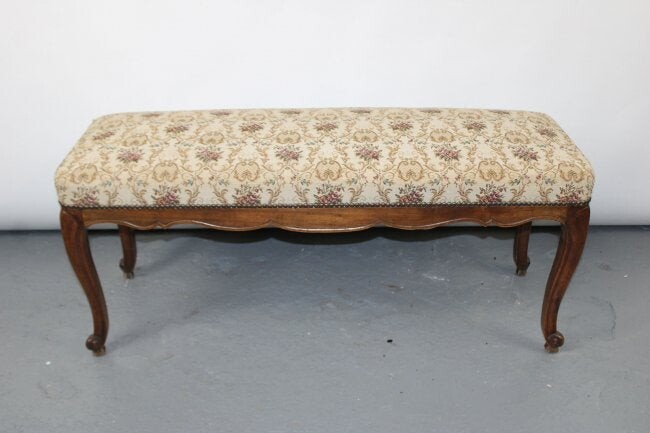 French Louis XV style backless bench in carved walnut