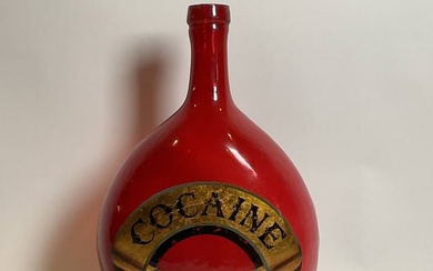 Glass Bottle with Cocaine Painted on Gold Leaf Banner