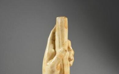 Hand holding a scroll, white patinated marble.