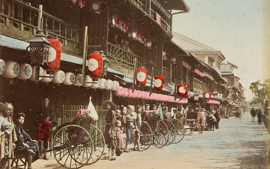 (JAPAN) A beautiful album of 50 hand-colored photographs depicting rich landscapes, busy street...