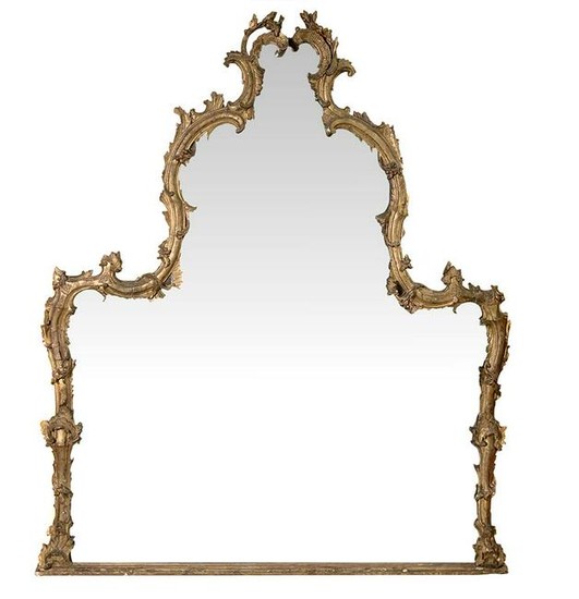 Large mirror in gilded wood, carved foliage. Late