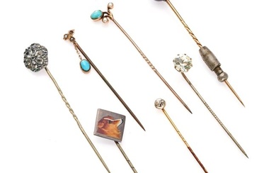 NO RESERVE - A GROUP OF STICK / TIE PINS comprising a banded agate pin, a white paste stone pin, an